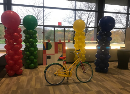 multi colored columns with bicycle